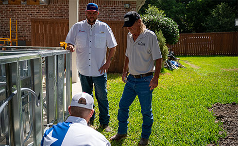 plumber in irving, tx fixing outdoor plumbing